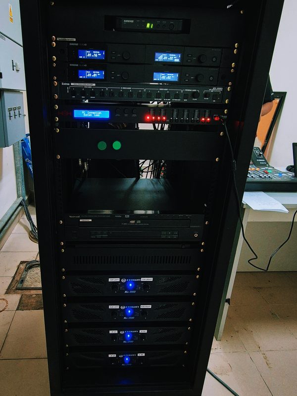 Full equipment rack with amplifiers, digital signal processing and control units